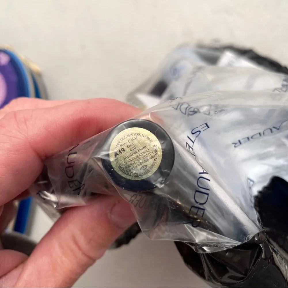 Estée Lauder bag, lipstick, night repair, cleanser